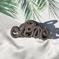 Macro view of a matte brown hair claw clip featuring a creative LOVE letter design - Dark Coffee