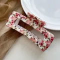 Close-up of a square hair claw clip featuring pink floral patterns on a mesh background - Pink Rose