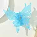 Detail of light blue translucent butterfly hair claw with a strong gold metal spring - Blue