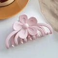 Close-up of a pink matte flower hair claw clip with sturdy multi-tooth design for thick hair - Light Pink