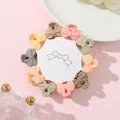 Detailed view of 10-piece mini bow hair claws set in matte candy colors on display card - Bowknot Style (K)