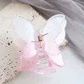 Detail of pink gradient butterfly hair claw clip with transparent resin and gold spring - Pink