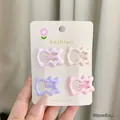 Detail view of 4-piece pastel wave hair clips on display card with 3cm size label - Bear