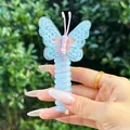 Detailed close-up of light blue embroidered butterfly hair accessory with spiral telephone wire - Bowknot Style / Milky White