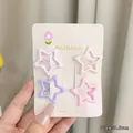 Detail view of 3.5cm star-shaped hair clips in pastel macaron colors on display card - Pentagram