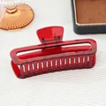Elegant large translucent red acrylic hair claw clip with a hollow rectangular design - Burnt Red