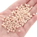 Creamy beige 5x5mm glass beads held in hand for handmade DIY jewelry crafts - 10g/Pack (Approx. 100 Beads) / Apricot