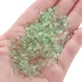 Hand holding light green square glass crystal beads for DIY jewelry making - 1x3mm (1g/Pack, Approx. 50 Pcs) / Flat Square Style (BBA118) / Green