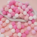 Pink and white polyester pom poms in a white tray for creative DIY Christmas crafts - 50 Pieces / 2cm / Pink Series