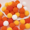 Polyester plush pom-poms in vibrant orange, yellow, and white for DIY crafts - 20 Pieces Set / 3cm / Orange Series