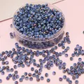 4mm iridescent light blue glass seed beads in a round shape for DIY jewelry making - 4mm 10g/Pack / Sapphire Blue
