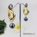 Detailed close-up of vintage 18K gold earrings with dark grey shell pearls on a stand - Dark Gray Pearl Style (HWX958-12)