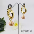 Detail of elegant 18K gold plated hoop earrings with pink shell pearls on a metal stand - Pink Purple Pearl Style (HWX958-16)