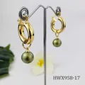 Detail of 18K gold hoop earring featuring a deep green pearl on a T-bar display stand - Deep Green Pearl Style (HWX958-17)