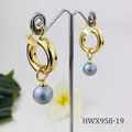 Detailed view of 18K gold plated hoop earrings with elegant grey pearl charms on a stand - Gray Blue Pearl Style (HWX958-19)