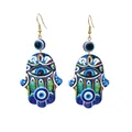 Detailed view of Hamsa hand earrings with colorful Evil Eye patterns and drop design - Dark Blue Geometric Eye