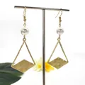 Close-up of geometric gold triangle earrings with pearl hooks on a T-stand display - White(HWX150-4)