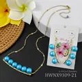 Gouden ketting en oorbellen set met blauwe parels op een Aloha presentatiekaart - Blauw (HWNX9309-21)