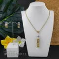 Macro detail of tropical gold hollow earrings and pearl necklace jewelry set - Grey Pearl(HWNX9439-11)
