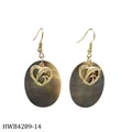 Close-up of tropical dangle earrings with natural black shell and golden dolphin heart - Dolphin and Heart Style (HWB4289-14)