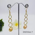 Golden textured geometric hoop drop earrings featuring natural shell pearl accents - Cream