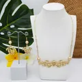 Parure de bijoux exotique avec collier tortue et boucles d'oreilles perles dorées - Style Perle Dorée