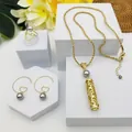 Parure dorée avec collier tube ajouré, bague et boucles d'oreilles perles cœur - Style Perle Grise (HWNX9703-11)