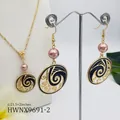 Detail of gold necklace and earring set with pink pearls and black enamel wave pendants - Light Pink Pearl Style (HWNX9691-2)