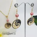 Detail of wave pattern jewelry set with pink pearls on a white mannequin display - Coral Pink Pearl Style (HWNX9691-8)