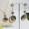 Close-up of gold twist chain necklace and wave earrings with pearls and black enamel - Dark Gray Pearl Style (HWNX9691-12)