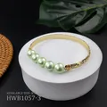 Engraved gold cuff bracelet with five light green natural pearls on a white stand - Pale Green Style (HWB1057-3)