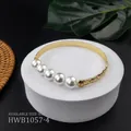 Detail of gold floral engraved copper bracelet with five large white pearls on stone stand - White Style (HWB1057-4)
