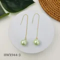 Detailed view of elegant light green pearl drop earrings with long gold tassel chains - Light Green Style (HWX944-3)
