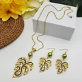 Macro detail of tropical monstera leaf jewelry set with olive pearls and gold chain - Olive Green Pearl Style (HWNX9484-5)