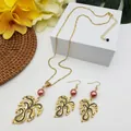 Detail of Monstera leaf jewelry set with pink pearls and gold alloy tropical necklace - Pink Purple Pearl Style (HWNX9484-8)