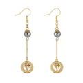 Detail of gold palm tree earrings with Hawaii engraving and grey pearl charms - HAWAII Hollow Palm Tree Disc