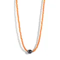 Macro view of faceted orange beads and dark central pearl on a minimalist choker - Orange Beads Iridescent Black Shell Pearl (Style 2)