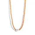 Close-up of orange crystal beaded choker featuring a single white pearl centerpiece - Orange Beads White Shell Pearl (Style 3)
