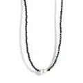 Detailed view of faceted black beaded choker with a central white shell pearl and gold accents - Black Beads White Shell Pearl (Style 7)