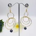 Exaggerated golden multi-layered circle earrings featuring a natural black pearl pendant - Gold / Iridescent Black-Purple (HWX814-1)