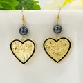 Detail of vintage heart earrings with floral engraving and black iridescent beads - Iridescent Black Bead Heart Style (HWX1616-1)