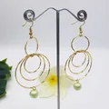Golden concentric circle drop earrings with pale green pearl on a clean white background - Gold / Light Green (HWX814-3)