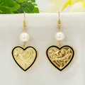 Detail of vintage heart earrings with floral relief, black enamel, and pearl accents - White Bead Heart Style (HWX1616-4)