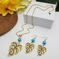 Detailed view of Hawaiian monstera leaf jewelry set with gold alloy and blue beads - Blue Pearl Style (HWNX9484-21)