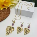 Detailed macro view of tropical monstera leaf jewelry set with purple pearls and gold finish - Purple Pearl Style (HWNX9484-22)