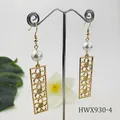 Detail of gold geometric hollow bar earrings with pearls and floral motifs on display - White Style (HWX930-4)