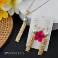 Hawaiian gold frangipani jewelry set with necklace and earrings on a tropical mat - Light Green Bead Style (HWNX9317-3)