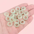 Translucent light green acrylic acetate ring beads held in hand for DIY jewelry - 14mm Inner Diameter Approximately 6mm Light Green 500 Pieces/pack