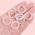 Handheld view of translucent pink acrylic bead rings for DIY jewelry accessories - 23mm Inner Diameter Approx. 16mm White 500 Pieces/pack