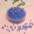 4mm faceted light blue iridescent crystal glass beads in a clear storage container - Sapphire Blue